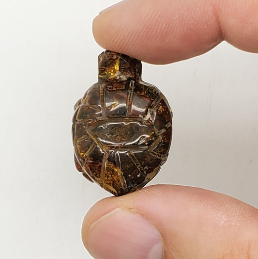 Turtle carving amber uv